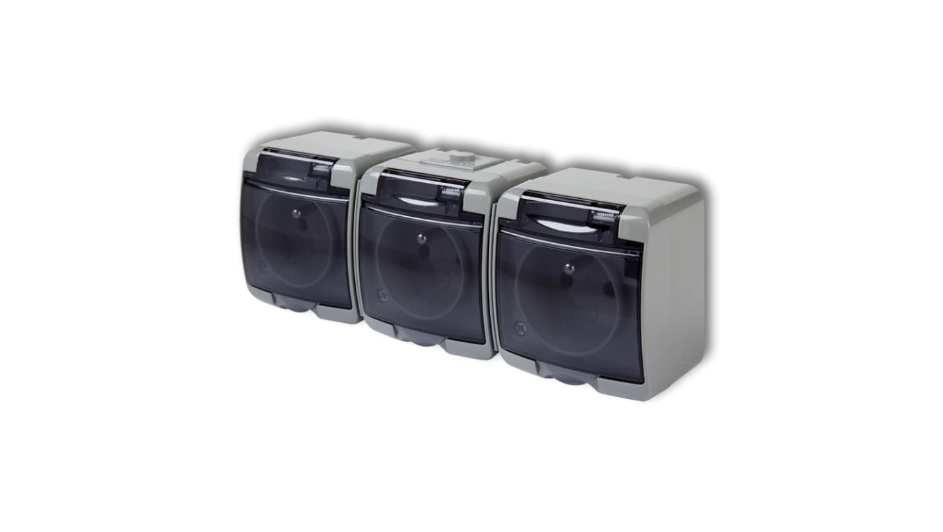 

JUNIOR Gniazdo potrójne z/u (klapka dymna) popielaty IP54 10GHE-3d, Klapka dymna) popielaty ip54 10ghe-3