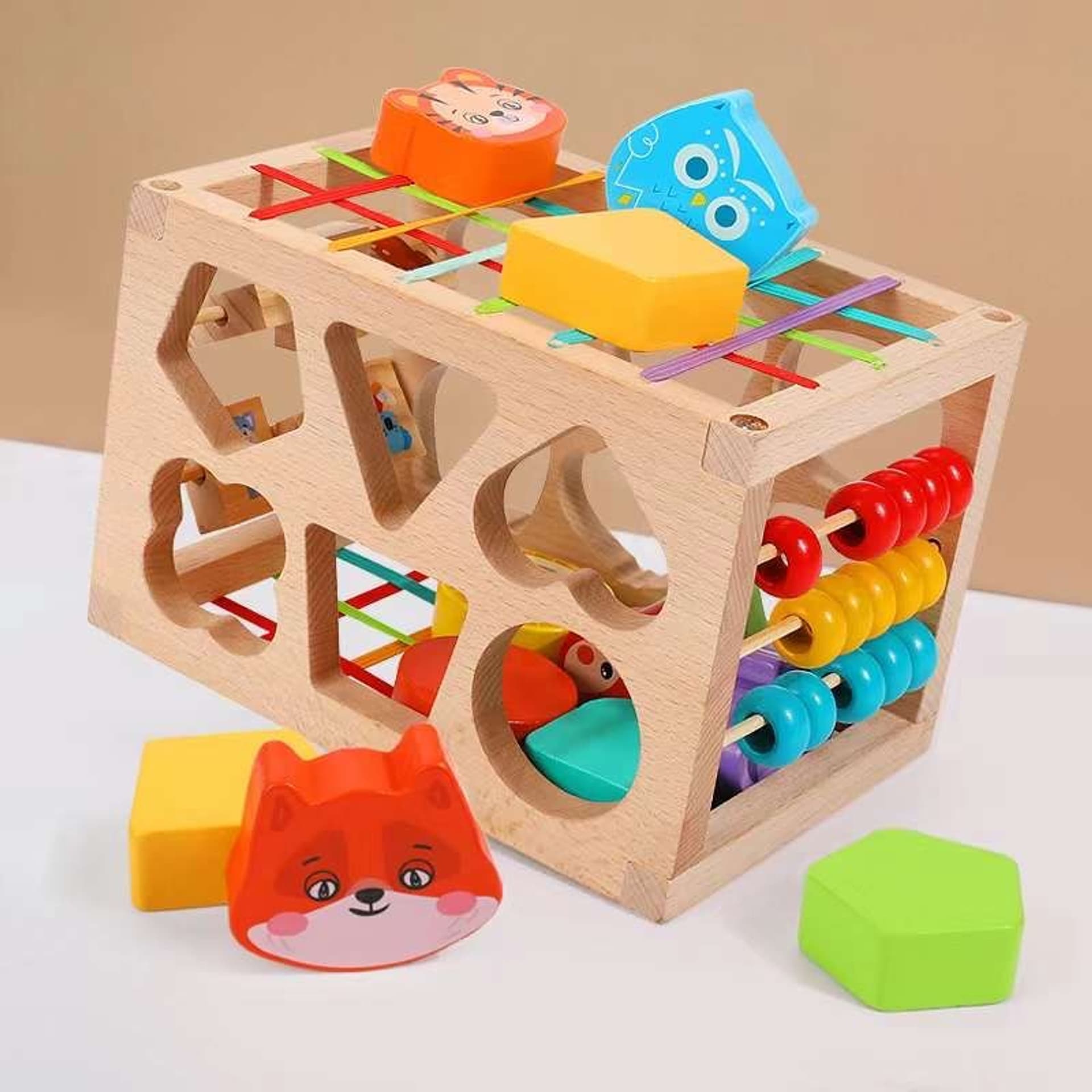 

DREWNIANY SORTER KLOCKÓW ELASTYCZNA KOSTKA SENSORYCZNA MONTESSORI GUMKI 12 KLOCKÓW