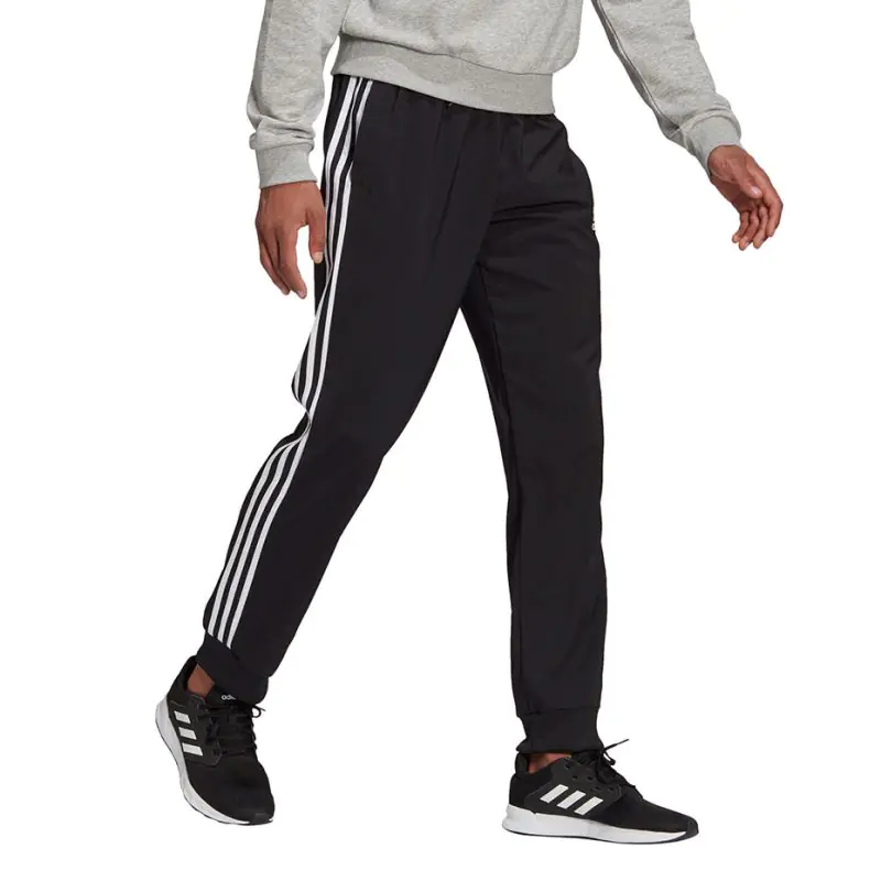 ⁨Spodnie adidas Essentials Tapered Cuff 3 Stripes M (kolor Czarny, rozmiar S)⁩ w sklepie Wasserman.eu