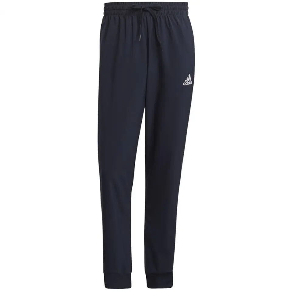 ⁨Spodnie adidas Essentials Tapered Cuff 3 Stripes Pants M GK8981 (kolor Granatowy, rozmiar S)⁩ w sklepie Wasserman.eu