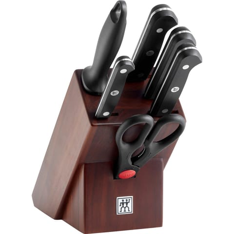 ⁨Set of 4 knives in a walnut block⁩ at Wasserman.eu