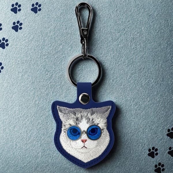 Etui na lokalizator / brelok Nimmy       Glasses Cool Cat niebieski