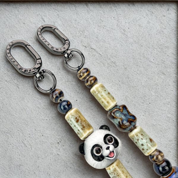 Zawieszka na torebkę handstrap Nimmy New Big Eye Cute Pets 2.0 czarny