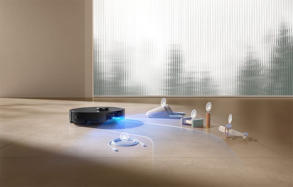 Na podłodze leżą rozrzucone przedmioty, takie jak kabel, zabawki, kartoniki, a robot Dreame wykrywa je przy użyciu niebieskiego światła skanującego.