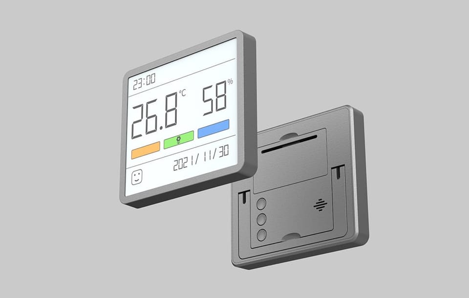 Dwa termo-higrometry z zegarem na szarym tle