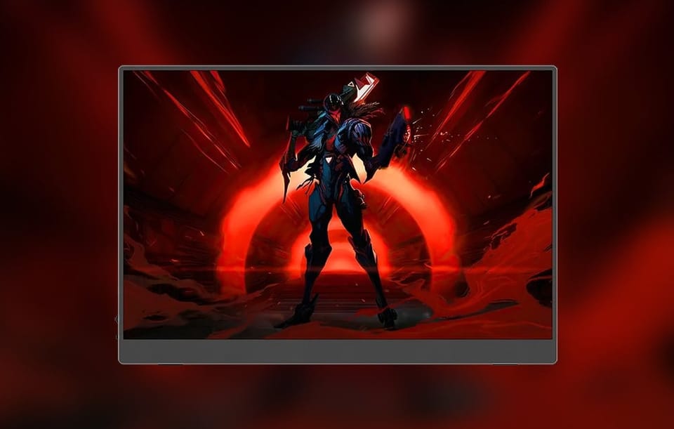 Przenośny monitor z postacią z gry na ekranie.